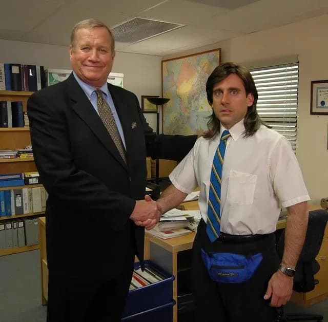 Two men shaking hands in an office